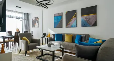 a living room with a couch and chairs at Havre de Paix à Noria Golf Marrakech in Marrakech