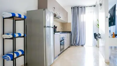 a kitchen with a stainless steel refrigerator at Havre de Paix à Noria Golf Marrakech in Marrakech