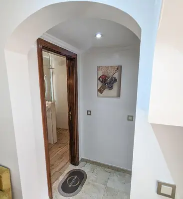 a hallway in a house with a mirror at Apartement Panoramic View Majorelle Garden with Pool in Marrakech
