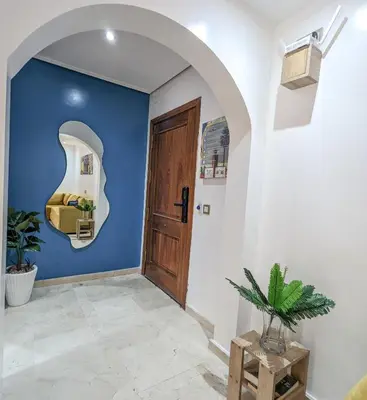 a room with a blue wall and a door at Apartement Panoramic View Majorelle Garden with Pool in Marrakech