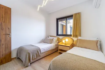 a bedroom with two beds and a window at Elegant and cozy 3 bedrooms in Hivernage in Marrakech