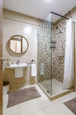 a bathroom with a sink and a shower at Elegant and cozy 3 bedrooms in Hivernage in Marrakech