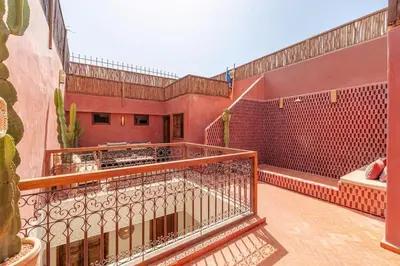 a balcony of a house with a tub at Riad Macan Exclusive and Trendy Chich Breakfast incl in Marrakech