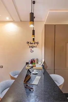 a conference room with a long table and chairs at Magnifique appartement unique et central! in Marrakech
