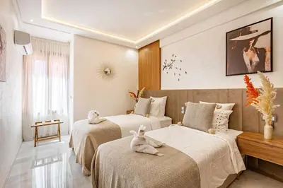 a bedroom with two beds with stuffed animals on them at Magnifique appartement unique et central! in Marrakech