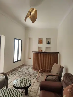 a living room with a couch and chairs and a table at Riad White Cactus in Marrakech