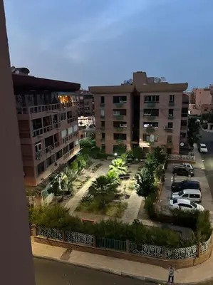 an aerial view of a parking lot in a city at Cosy & Calm studio in Marrakech
