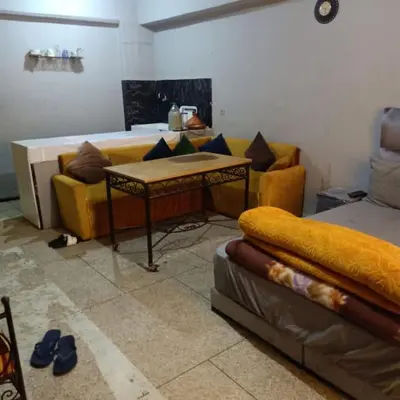 a living room with a couch and a table at Cosy & Calm studio in Marrakech