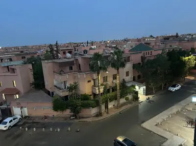 an aerial view of a city with cars parked on a street at Cosy & Calm studio in Marrakech