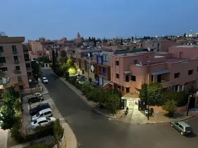 an aerial view of a city with cars parked on a street at Cosy & Calm studio in Marrakech