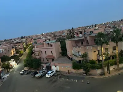 an aerial view of a city with cars parked at Cosy & Calm studio in Marrakech