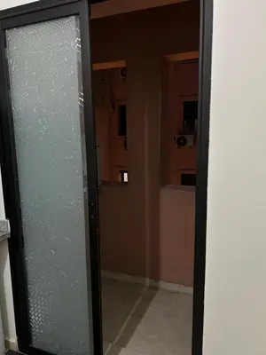 a glass door in a room with a hallway at Cosy & Calm appartement in Marrakech