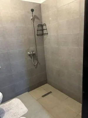 a shower stall in a bathroom with a toilet at Cosy & Calm appartement in Marrakech