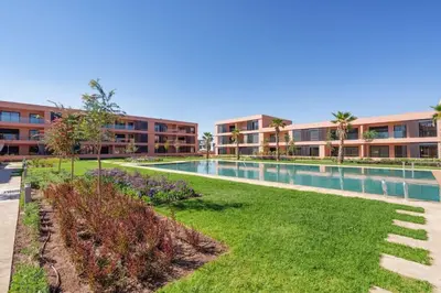 an image of a swimming pool at a apartment complex at Appartement NOVA Noria in Marrakech