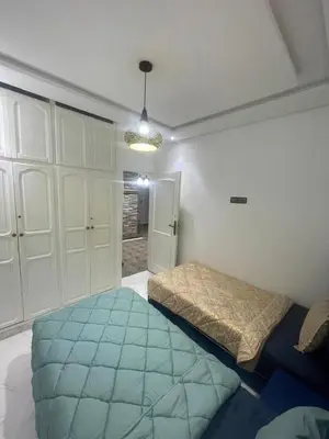 a bedroom with a large bed in a room at Luxury Apartment in Marrakesh two in Marrakech
