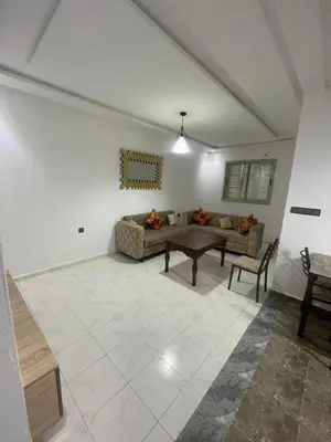 a living room with a couch and a table at Luxury Apartment in Marrakesh two in Marrakech
