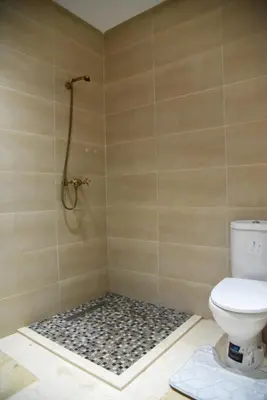 a bathroom with a toilet and a shower at M32 Cosy Loft in Marrakech