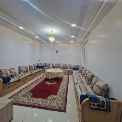 a living room with couches and a table and a rug at New DUPLEX jardins d'anas- Avenue guemassa Near Airport in Marrakech