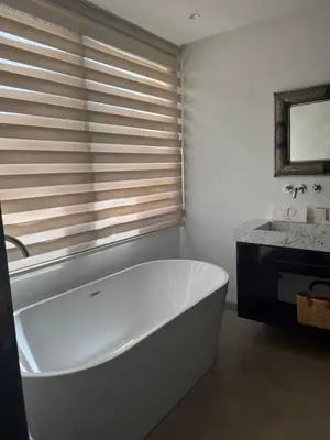 a white bath tub in a bathroom with a sink at AD Villa in Marrakech