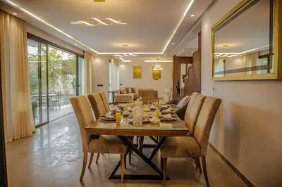 a dining room with a table and chairs at AD Villa in Marrakech