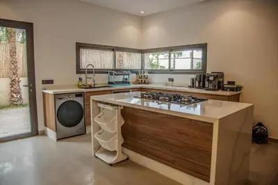 a kitchen with a stove and a dishwasher at AD Villa in Marrakech