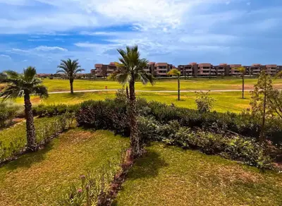 a group of palm trees in a park at Prestigious Apartment in Marrakech