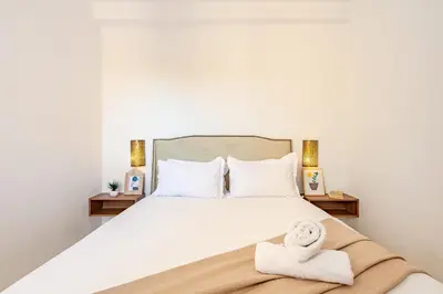 a bedroom with a bed with towels on it at Appartement familial à Marrakech in Marrakech