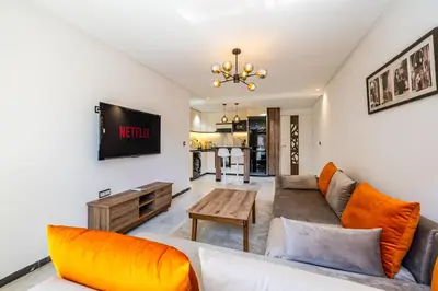 a living room with a couch and a table at Luxurious City Apartment in Marrakech