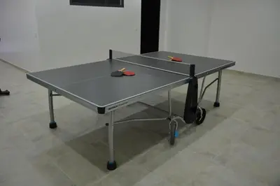 a ping pong table with two scissors on it at Atlas Royale Marrakech in Marrakech