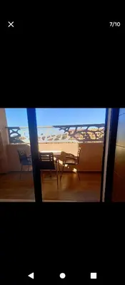 a view of a balcony with a table and chairs at Magnifique appartement in Marrakech