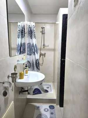 a small bathroom with a sink and a shower at Riad Miralezia in Marrakech