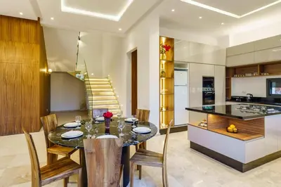 a kitchen and dining room with a table and chairs at Sublime Villa A in Marrakech