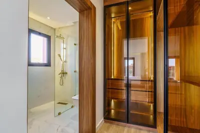 a bathroom with a glass shower and a toilet at Sublime Villa A in Marrakech