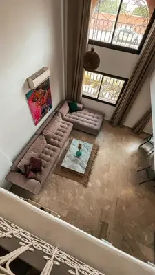 an overhead view of a living room with a couch at Duplex Jasmine in Marrakech