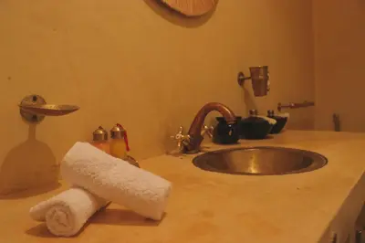 a kitchen counter with a sink and a towel at Riad CHEZ MOI in Marrakech