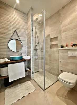 a bathroom with a shower and a toilet and a sink at Somptueuse Family Villa Cherifa avec piscine chauffée in Marrakech