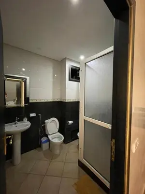 a bathroom with a toilet and a sink at L'empreinte Appart Marrakech in Marrakech