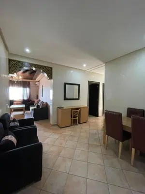 a large living room with couches and a table at L'empreinte Appart Marrakech in Marrakech