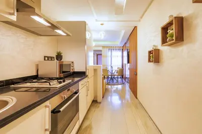 a kitchen with a sink and a stove top oven at Menara garden in Marrakech
