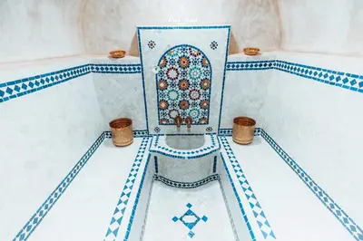 a room with a mosque with a tile floor at Riad Aslal in Marrakech