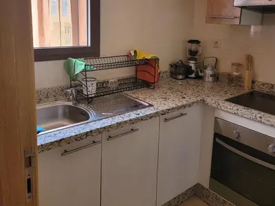a kitchen with a sink and a counter top at les jardins d'atlas waky palm golf in Marrakech