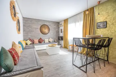 a living room with a couch and a table at Appartamento 14 a Guelize Hivernage in Marrakech