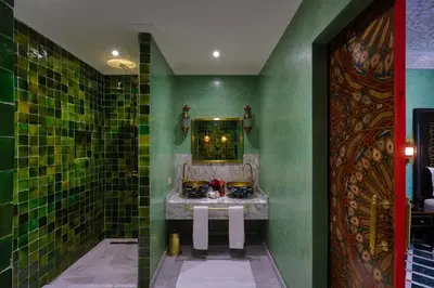 a bathroom with a sink and a mirror at Alrashid Marrakech Boutique Hotel & SPA in Marrakech