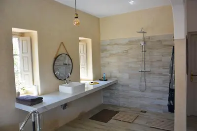 a bathroom with a sink and a mirror at Villa Tulum - Indoor Spa & Pools in Marrakech