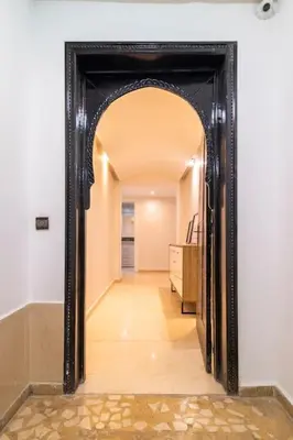 a hallway with a large mirror in a room at Appartement Miramas 2 Gueliz pool,Gym in Marrakech