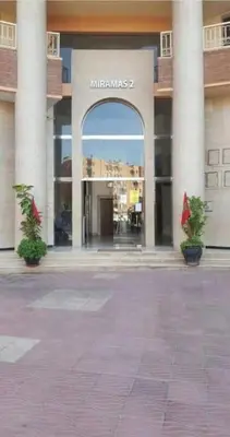 a building with an entrance to a shopping mall at Appartement Miramas 2 Gueliz pool,Gym in Marrakech