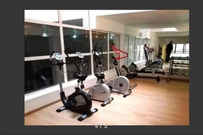 a gym with several treadmills and exercise bikes at Appartement Miramas 2 Gueliz pool,Gym in Marrakech