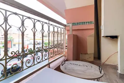 a balcony with a bench in front of a window at Appartement Miramas 2 Gueliz pool,Gym in Marrakech