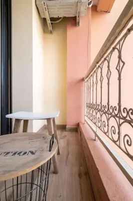 a balcony of a building with a table on it at Appartement Miramas 2 Gueliz pool,Gym in Marrakech