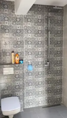 a bathroom with a shower and a toilet in it at appartement de luxe a Marrakech in Marrakech